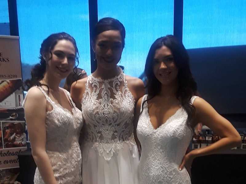 Three customers in white dresses.