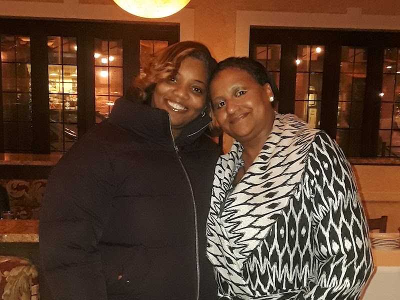 Katrinca Lewis, owner of CDC transportation, and a customer.