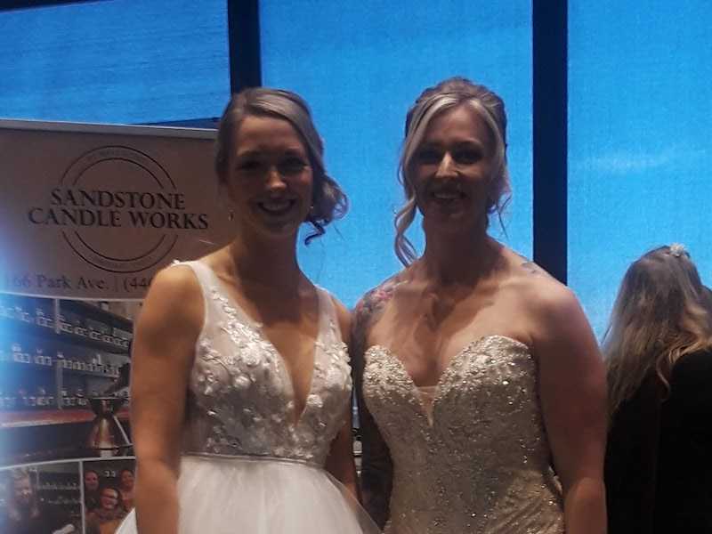 Two customers in white dresses.